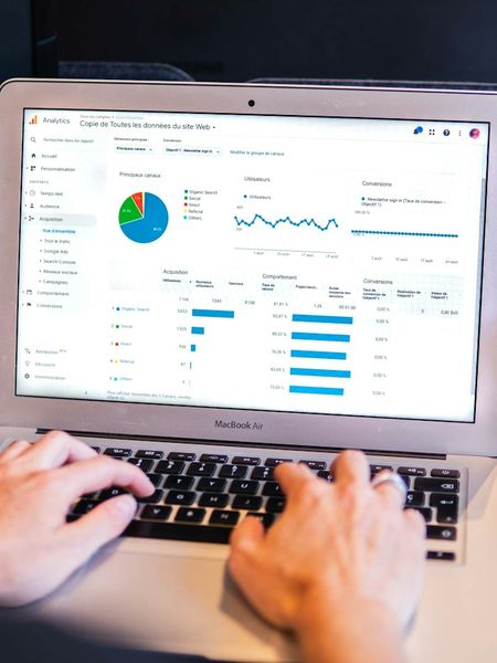 A business owner reviewing analytics on a laptop